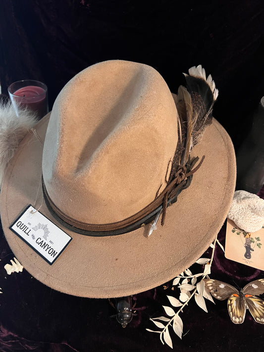 Burned light leather hat with leather wraps and feathers Quill Canyon